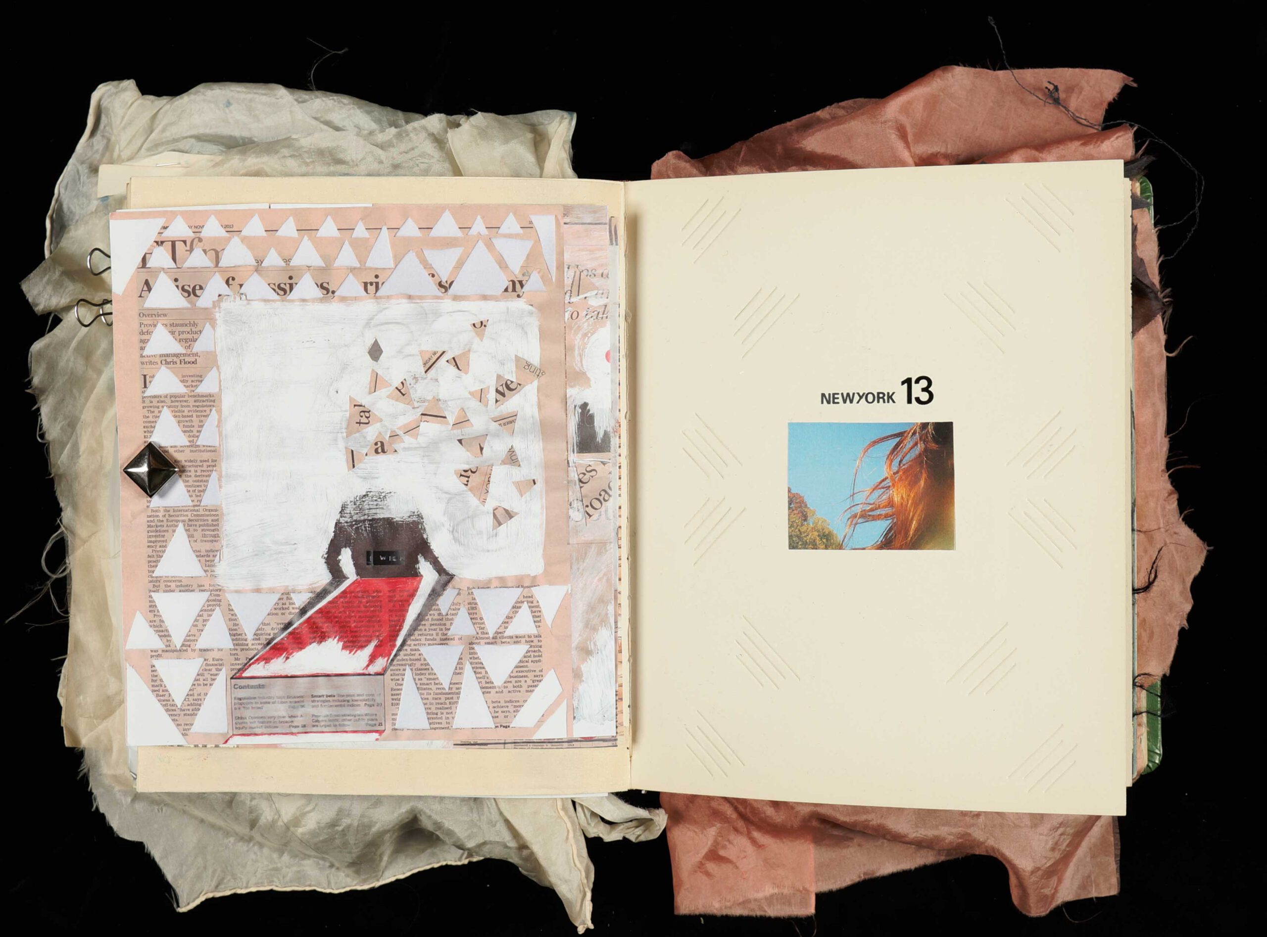 Triangle collage in a sketch book made out of the Financial Times