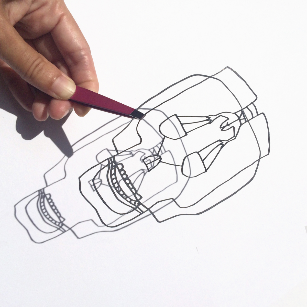 Scherenchnitt-Lasercut: filigraner Totenkopf