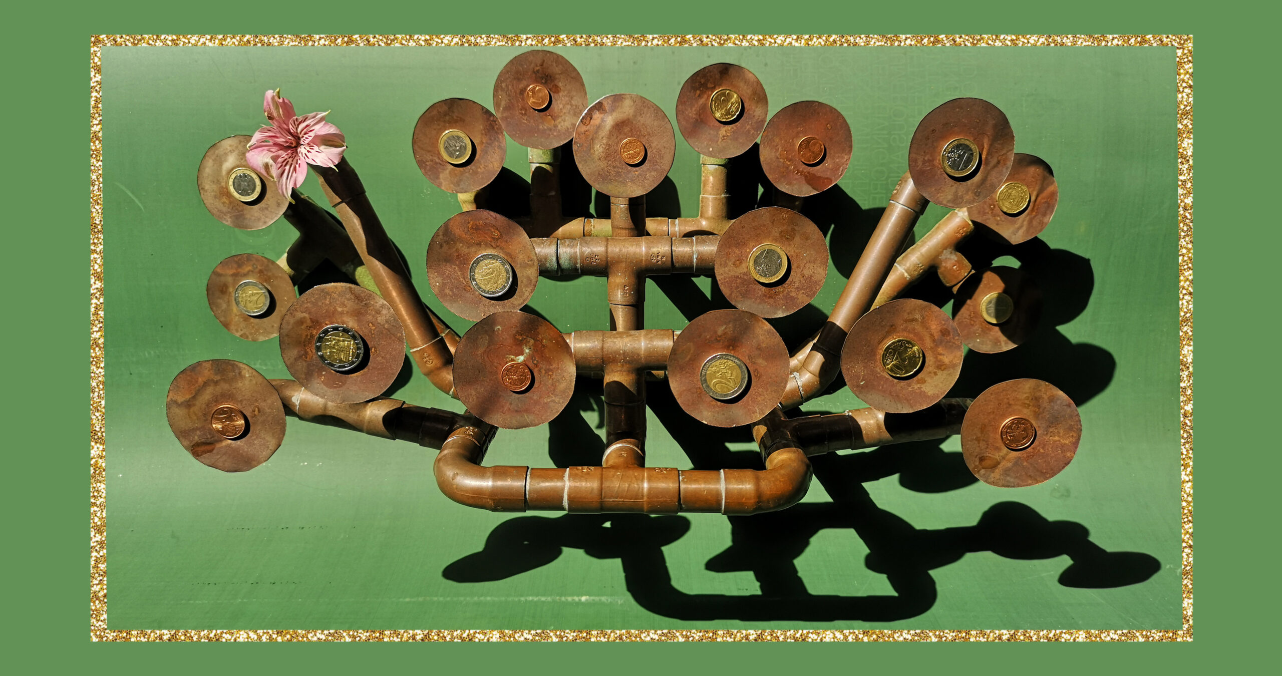 Money Machines -Sculpture with coins and pink lily and green background