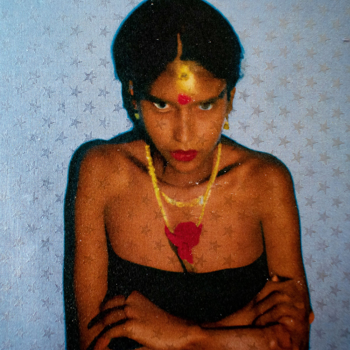 Young brown woman looking directly into the camera with very stern look. Starry background. AI created fake photo documentary art series.